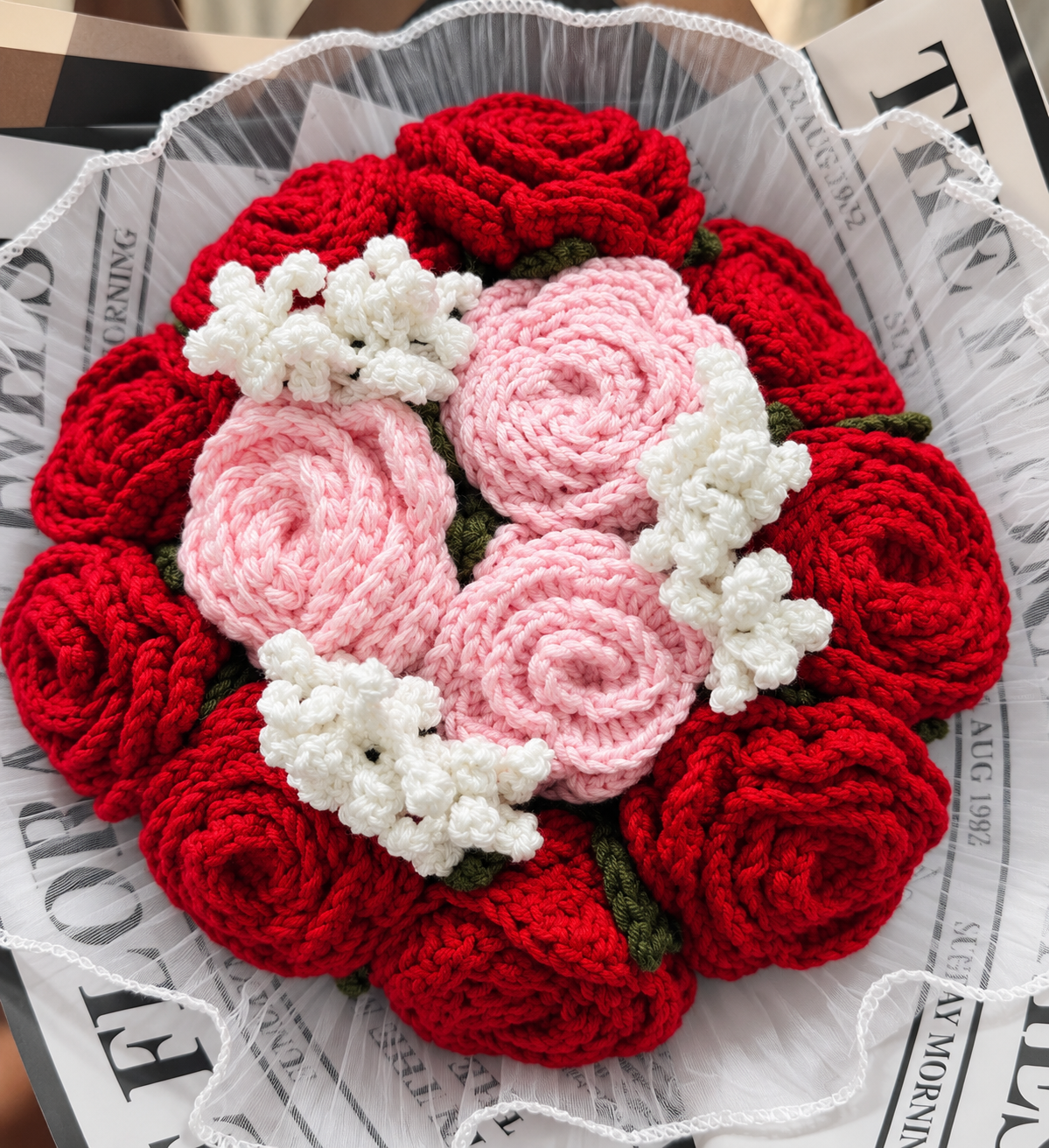 Close-up of Always & Forever Bouquet showing the red and blush pink roses, white fillers and organza trim.