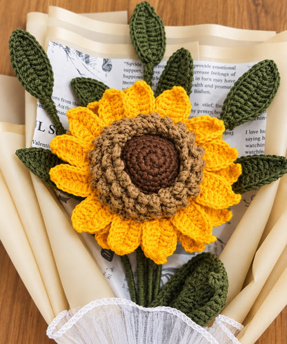 Close up of layered yellow crochet sunflower petals and textured centre