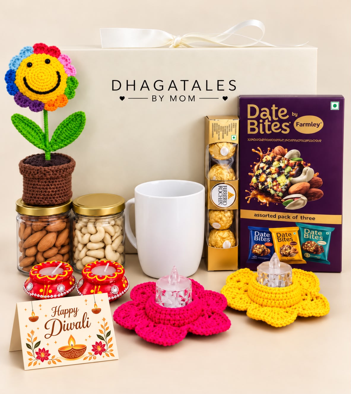 Festive Smiles corporate Diwali hamper with rainbow crochet flower pot, white mug, almond and cashew jars, chocolates, two crochet LED holders, two clay diyas and Diwali card