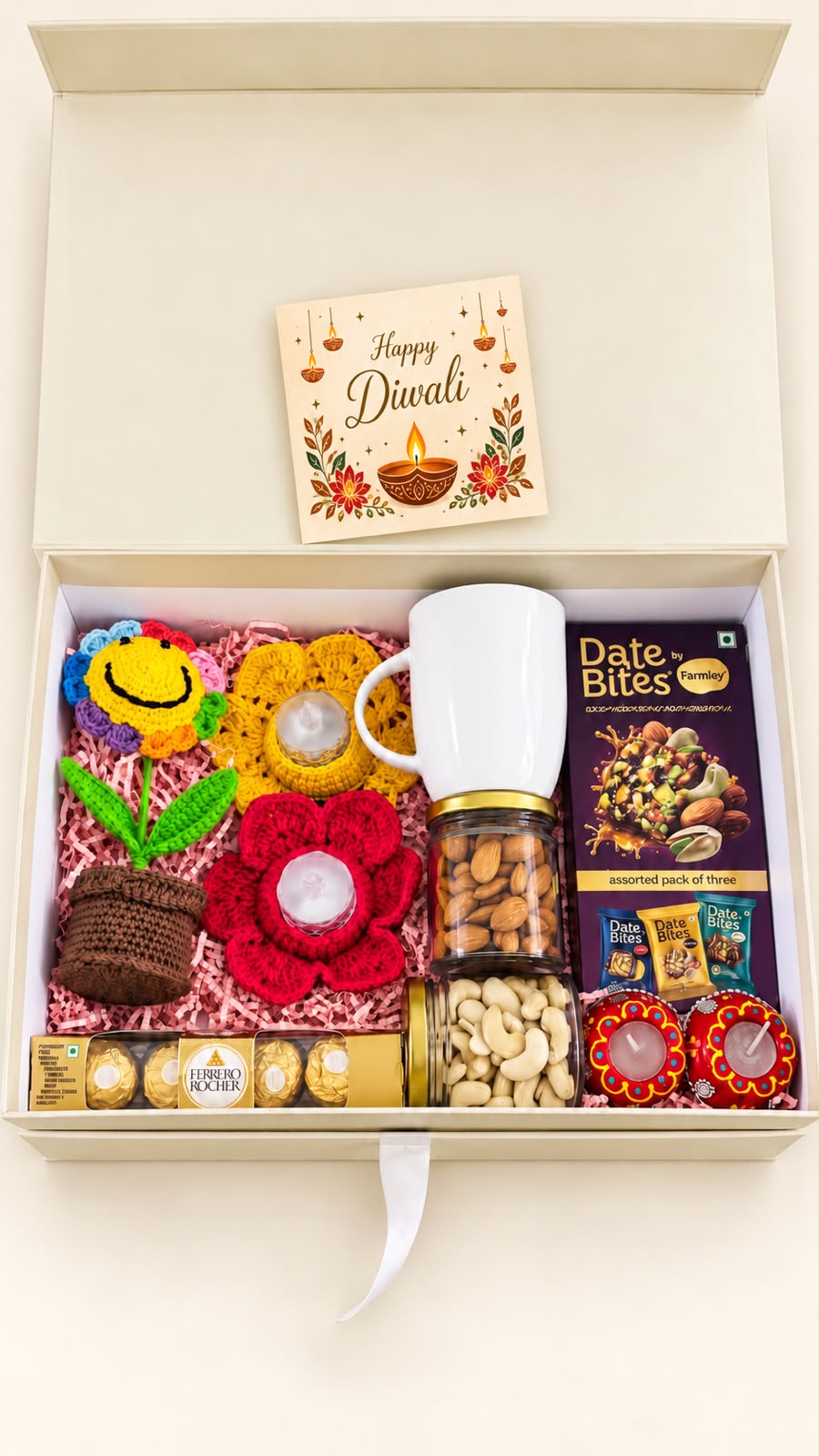 Top view of Festive Smiles corporate Diwali hamper in an ivory gift box with pink filling