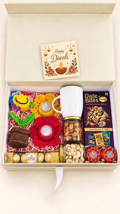 Top view of Festive Smiles corporate Diwali hamper in an ivory gift box with pink filling