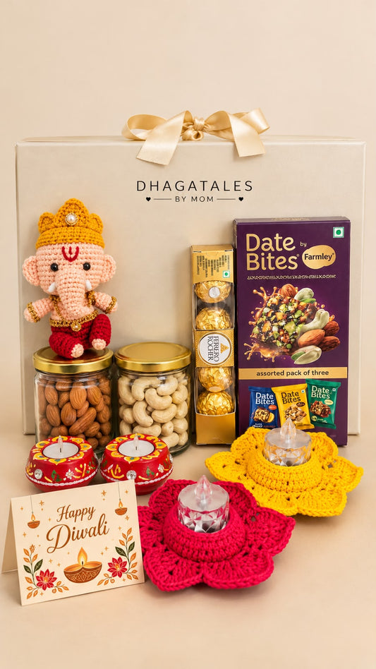 Divine Blessings Diwali hamper with crochet Ganesh, two crochet holders with LED tealights, two clay diyas, almond and cashew jars, Date Bites, Ferrero Rocher and Diwali card